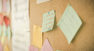Post-its on a cork wall